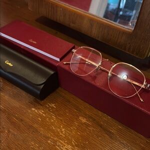 Cartier Gold Round Metal Glasses with Burgundy and Black Cases